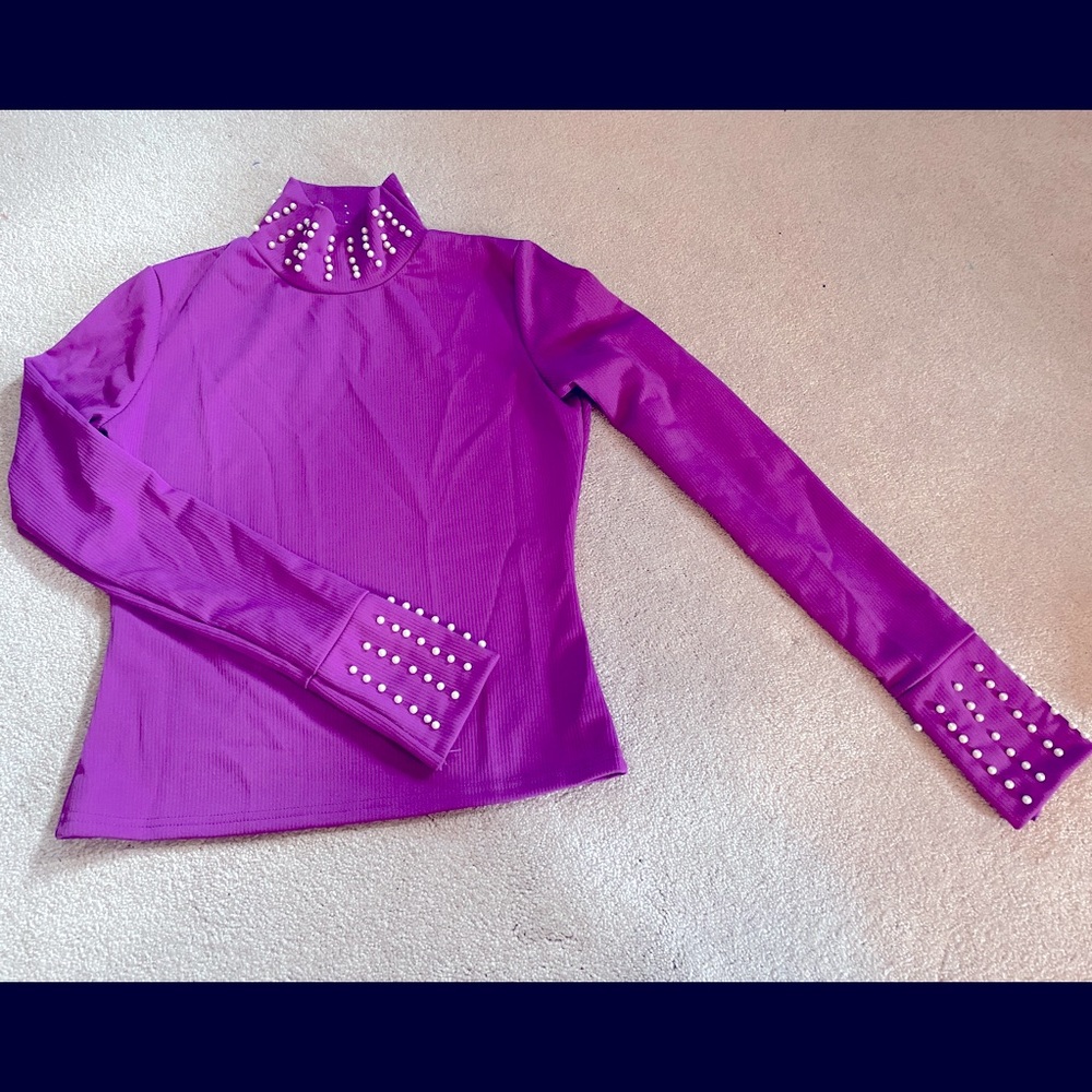 Purple beaded mock neck top.